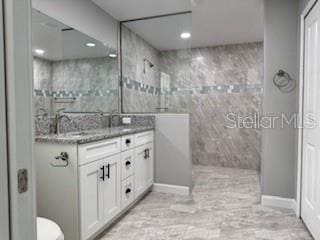 1467 E Odin Dr, Citrus Springs, FL 34434 - full bath with vanity, walk in shower, and recessed lighting