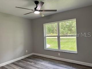 1467 E Odin Dr, Citrus Springs, FL 34434 - empty room with wood finished floors and a ceiling fan