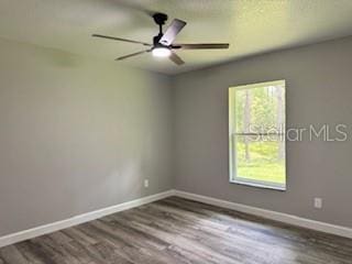 1467 E Odin Dr, Citrus Springs, FL 34434 - spare room with wood finished floors and a ceiling fan