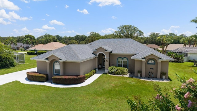 3629 SE 54th Ave, Ocala, FL 34480 - view of front of property with stucco siding, a front lawn, and roof with shingles