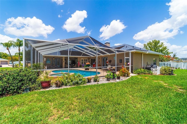3629 SE 54th Ave, Ocala, FL 34480 - back of property with a patio area, an outdoor pool, glass enclosure, and a chimney