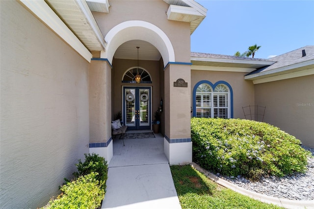 3629 SE 54th Ave, Ocala, FL 34480 - view of exterior entry featuring french doors and stucco siding