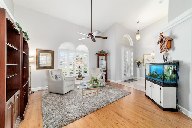 3629 SE 54th Ave, Ocala, FL 34480 - living area with a ceiling fan, light wood-style floors, and high vaulted ceiling