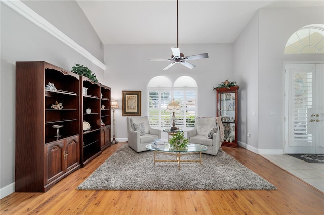 3629 SE 54th Ave, Ocala, FL 34480 - living room with high vaulted ceiling, a ceiling fan, and light wood finished floors
