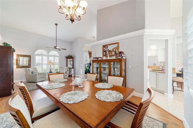 3629 SE 54th Ave, Ocala, FL 34480 - dining room featuring high vaulted ceiling, light wood-style floors, arched walkways, and ceiling fan