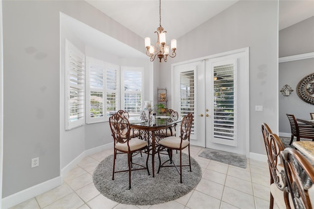 3629 SE 54th Ave, Ocala, FL 34480 - dining area featuring a chandelier, lofted ceiling, light tile patterned floors, and french doors
