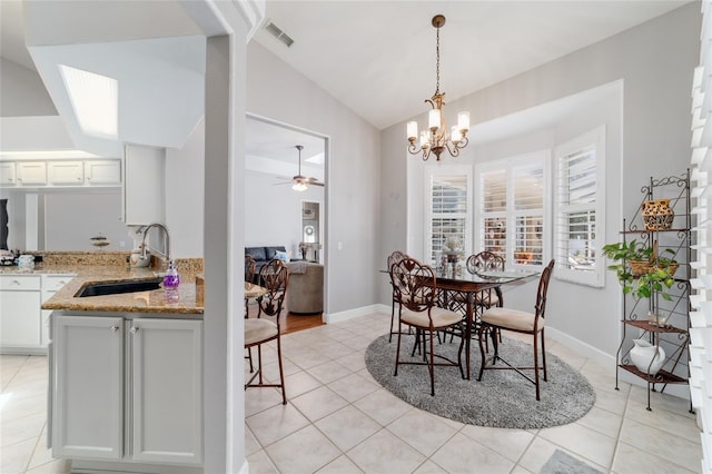 3629 SE 54th Ave, Ocala, FL 34480 - dining area with lofted ceiling, light tile patterned flooring, a ceiling fan, and a chandelier