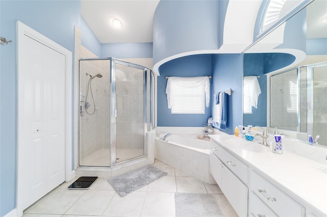 3629 SE 54th Ave, Ocala, FL 34480 - bathroom with a stall shower, a garden tub, vanity, and tile patterned floors