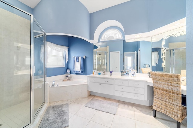 3629 SE 54th Ave, Ocala, FL 34480 - full bath featuring high vaulted ceiling, vanity, a garden tub, a shower stall, and healthy amount of natural light