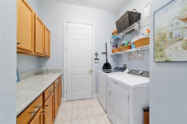 3629 SE 54th Ave, Ocala, FL 34480 - laundry area featuring washer and clothes dryer, light tile patterned floors, and cabinet space