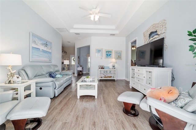 3629 SE 54th Ave, Ocala, FL 34480 - living area featuring light wood-style flooring, a raised ceiling, and a ceiling fan