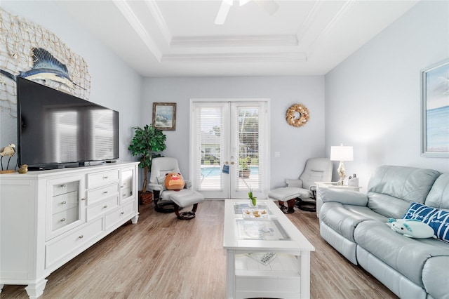 3629 SE 54th Ave, Ocala, FL 34480 - living area with a raised ceiling, light wood-style floors, french doors, crown molding, and ceiling fan