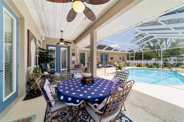 3629 SE 54th Ave, Ocala, FL 34480 - view of patio / terrace featuring french doors, a ceiling fan, outdoor dining area, and glass enclosure