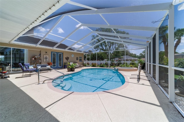 3629 SE 54th Ave, Ocala, FL 34480 - view of swimming pool featuring a patio area, a pool with connected hot tub, french doors, and a lanai