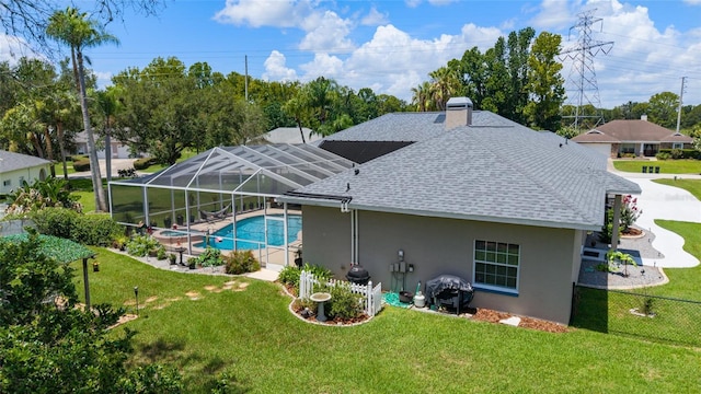 3629 SE 54th Ave, Ocala, FL 34480 - rear view of property featuring roof with shingles, stucco siding, and a lawn