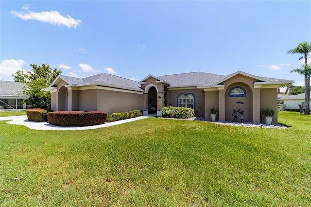 3629 SE 54th Ave, Ocala, FL 34480 - single story home with stucco siding and a front yard