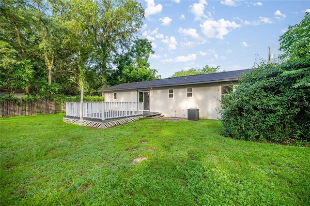 6021 NW 54th Ter, Ocala, FL 34482 - rear view of property featuring stucco siding and a wooden deck