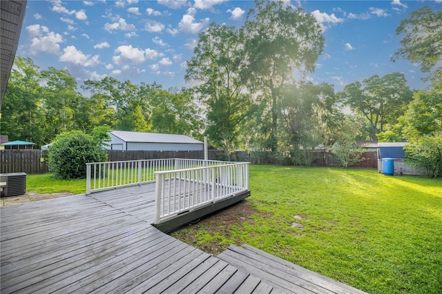 6021 NW 54th Ter, Ocala, FL 34482 - deck featuring a fenced backyard, a storage unit, and view of scattered trees