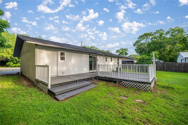 6021 NW 54th Ter, Ocala, FL 34482 - rear view of property featuring stucco siding and a wooden deck