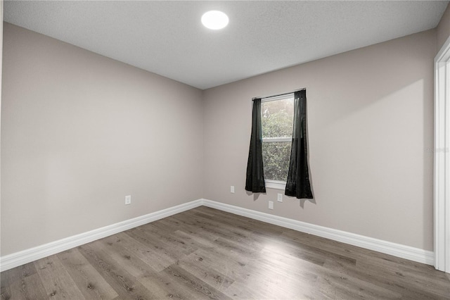 6021 NW 54th Ter, Ocala, FL 34482 - unfurnished room featuring wood finished floors