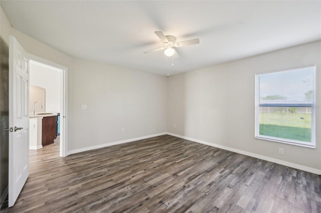 146 Juniper Loop Cir, Ocala, FL 34480 - empty room featuring a ceiling fan and dark wood-style floors