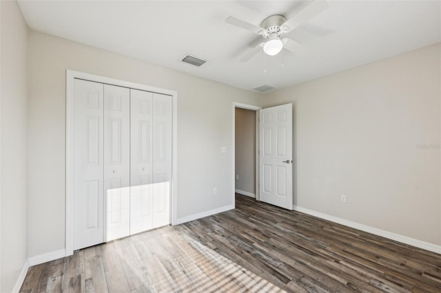 146 Juniper Loop Cir, Ocala, FL 34480 - unfurnished bedroom with wood finished floors, a closet, and a ceiling fan