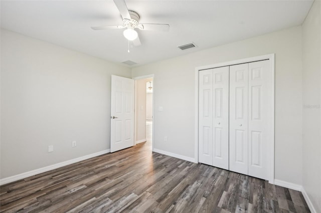146 Juniper Loop Cir, Ocala, FL 34480 - unfurnished bedroom with wood finished floors, a closet, and a ceiling fan