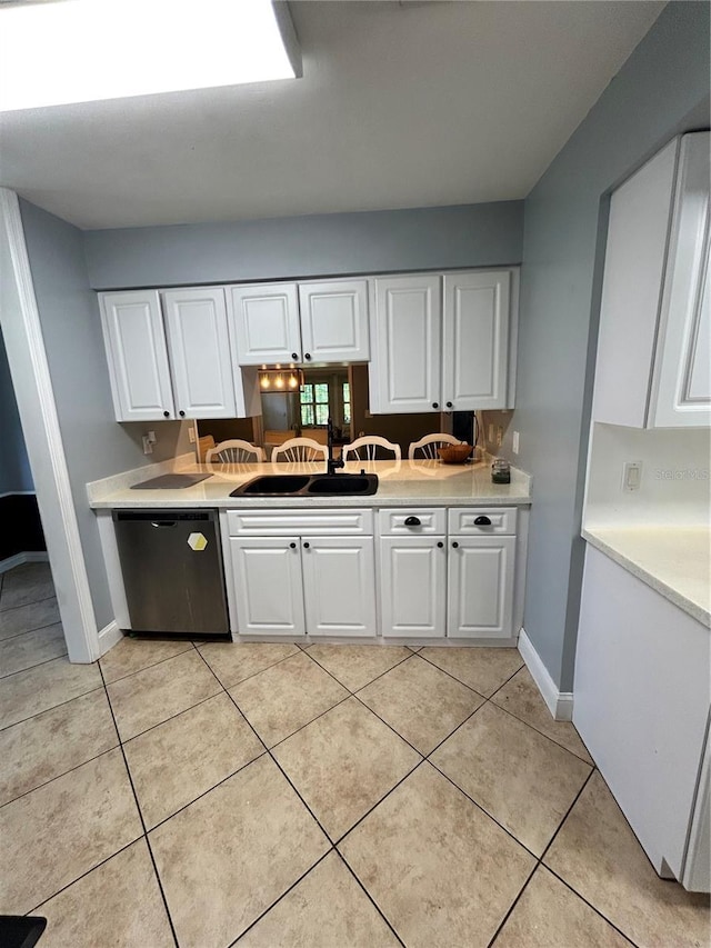 2070 SE 50th Ter, Ocala, FL 34480 - kitchen featuring dishwasher, white cabinetry, light countertops, and light tile patterned floors