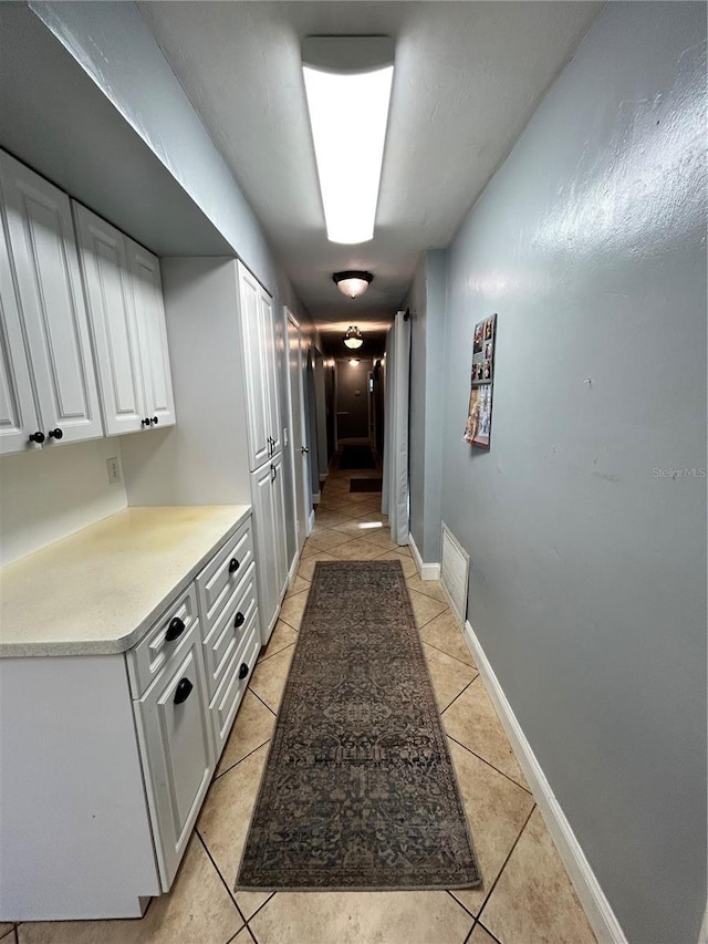 2070 SE 50th Ter, Ocala, FL 34480 - hallway with light tile patterned floors