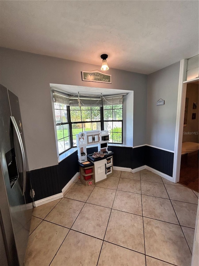 2070 SE 50th Ter, Ocala, FL 34480 - dining space with light tile patterned flooring and baseboards
