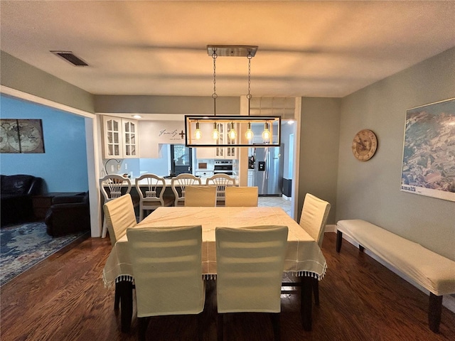 2070 SE 50th Ter, Ocala, FL 34480 - dining space with dark wood finished floors and a chandelier