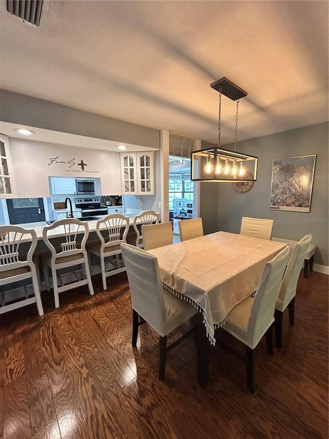 2070 SE 50th Ter, Ocala, FL 34480 - dining room featuring dark wood-type flooring and recessed lighting