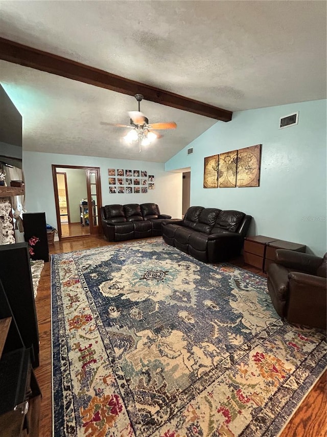 2070 SE 50th Ter, Ocala, FL 34480 - living area featuring wood finished floors, ceiling fan, and a textured ceiling
