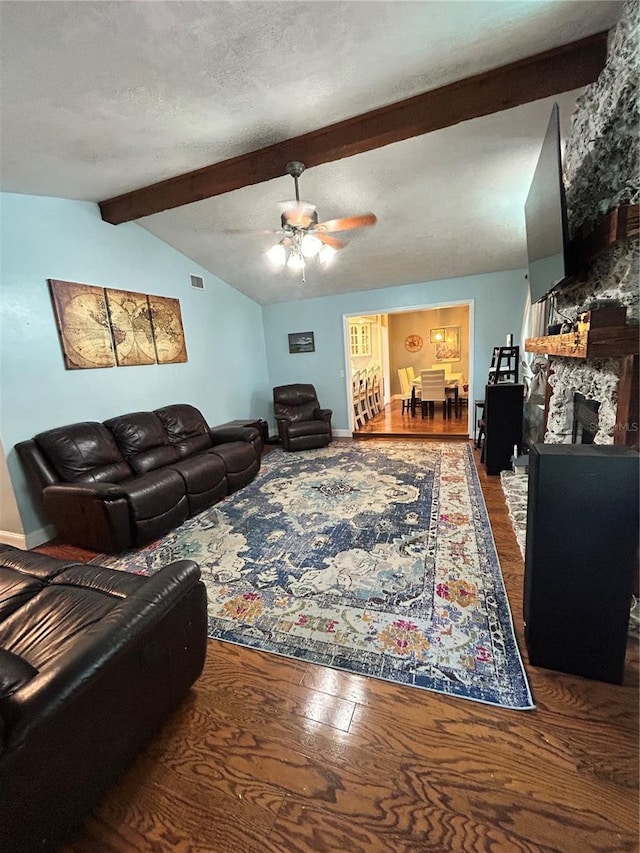 2070 SE 50th Ter, Ocala, FL 34480 - living area featuring wood finished floors, ceiling fan, and a stone fireplace