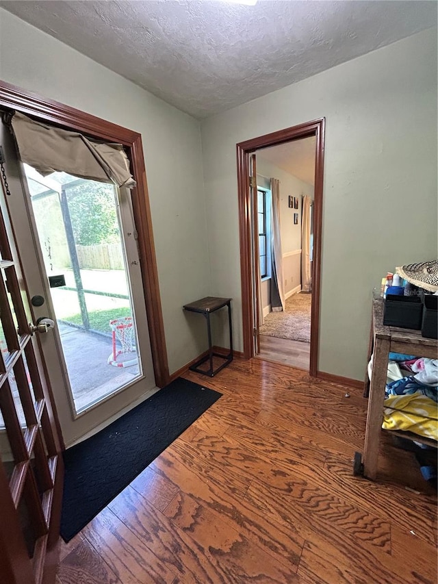 2070 SE 50th Ter, Ocala, FL 34480 - entryway featuring wood finished floors and a textured ceiling