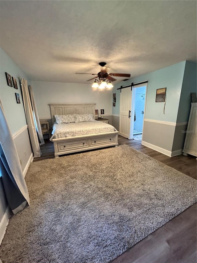 2070 SE 50th Ter, Ocala, FL 34480 - bedroom with dark wood-type flooring, a textured ceiling, and ceiling fan