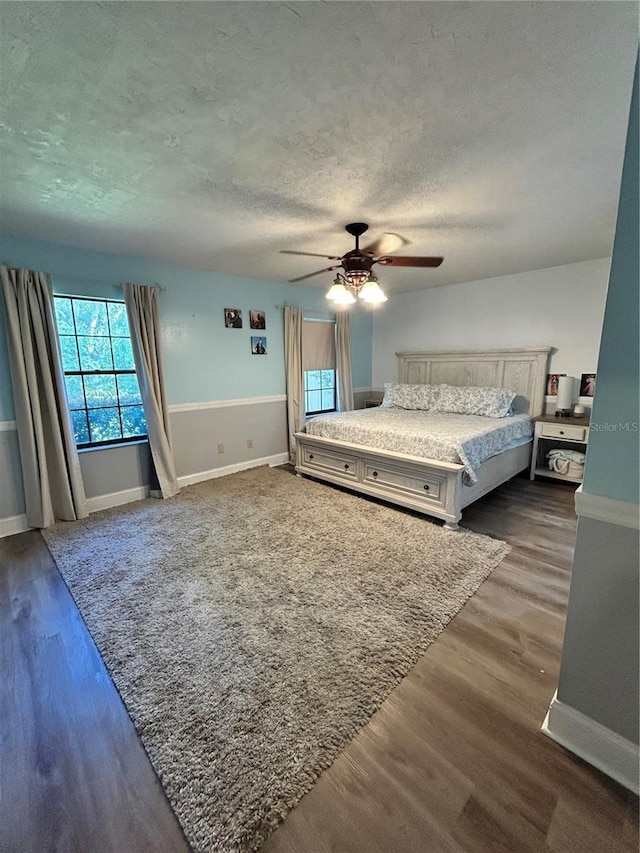 2070 SE 50th Ter, Ocala, FL 34480 - bedroom featuring a textured ceiling, wood finished floors, and ceiling fan