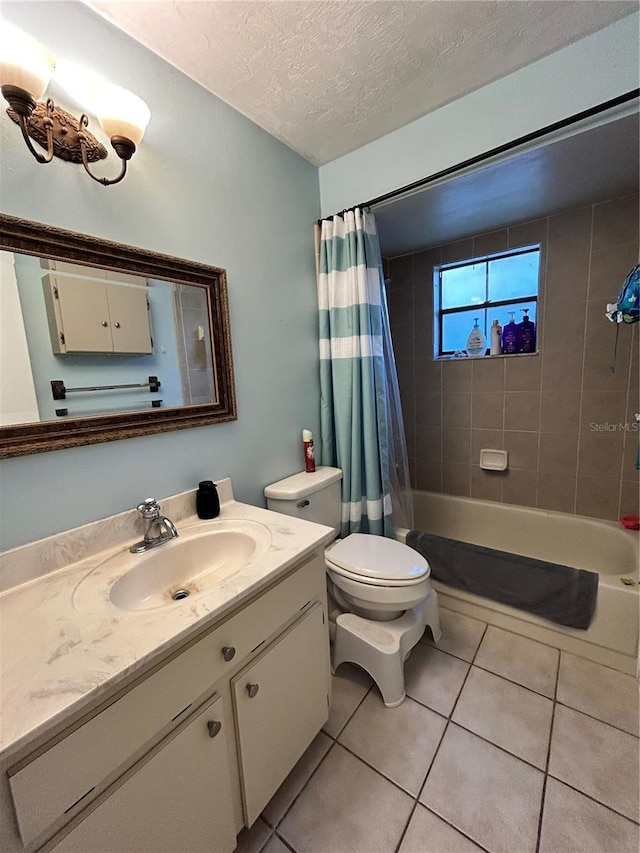 2070 SE 50th Ter, Ocala, FL 34480 - bathroom with vanity, tile patterned flooring, a textured ceiling, and shower / tub combo with curtain