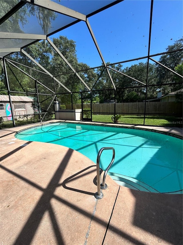 2070 SE 50th Ter, Ocala, FL 34480 - view of swimming pool featuring a fenced backyard, a patio, and glass enclosure