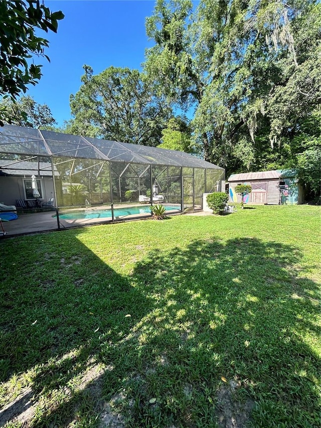 2070 SE 50th Ter, Ocala, FL 34480 - view of green lawn featuring an outdoor pool, glass enclosure, and a patio