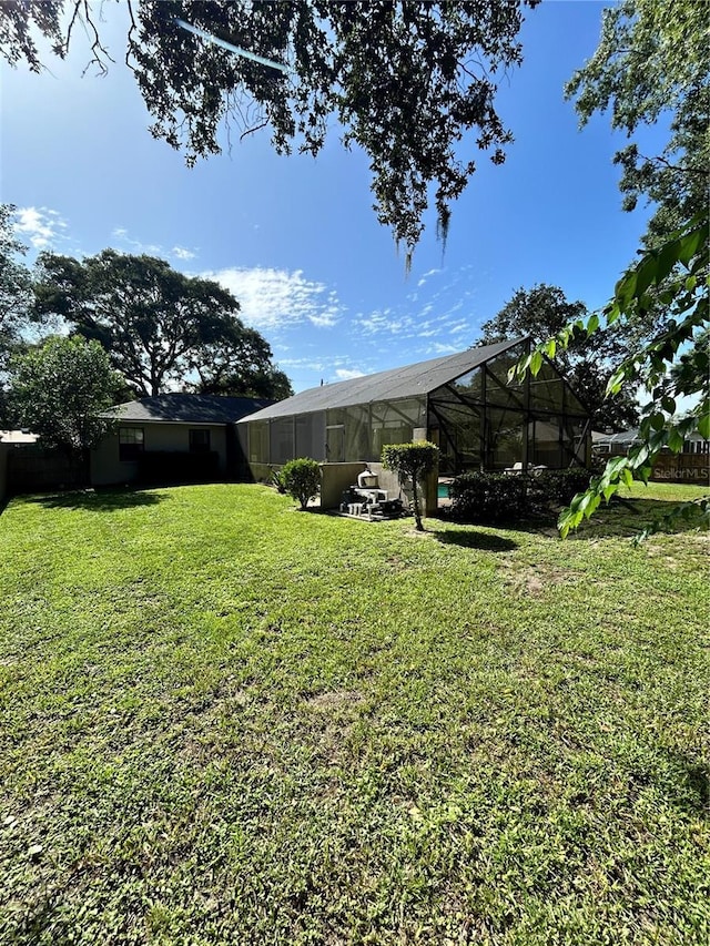 2070 SE 50th Ter, Ocala, FL 34480 - view of green lawn featuring a lanai
