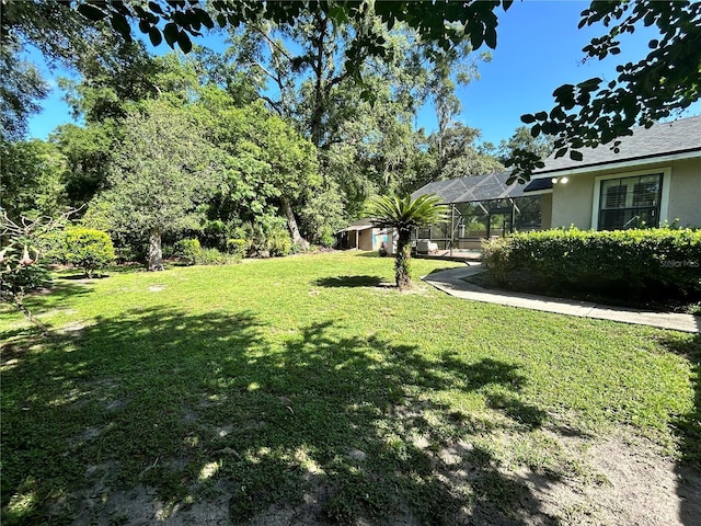 2070 SE 50th Ter, Ocala, FL 34480 - view of grassy yard with a lanai