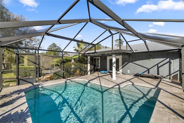 5002 SE 7th Pl, Ocala, FL 34471 - outdoor pool featuring a patio area and glass enclosure
