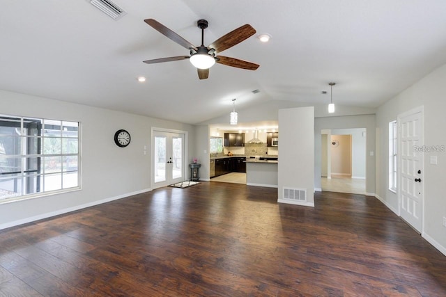 5002 SE 7th Pl, Ocala, FL 34471 - unfurnished living room with vaulted ceiling, a ceiling fan, dark wood-style flooring, french doors, and recessed lighting