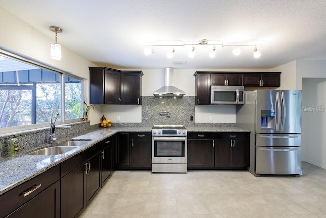 5002 SE 7th Pl, Ocala, FL 34471 - kitchen with stainless steel appliances, wall chimney exhaust hood, light stone countertops, backsplash, and dark brown cabinetry