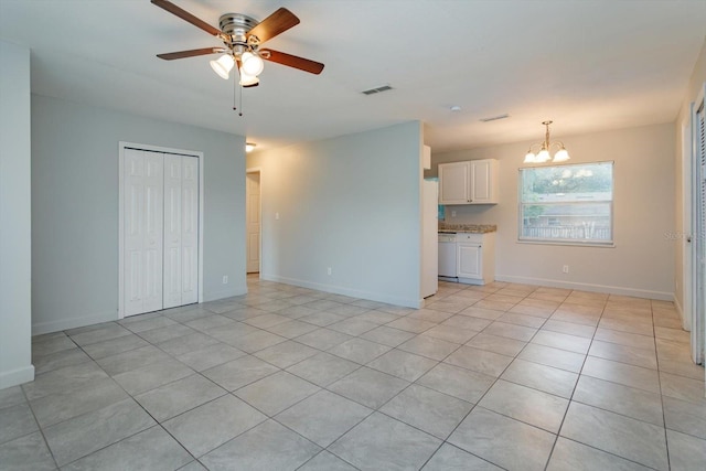 956 Osceola Trl, Casselberry, FL 32707 - unfurnished living room with a chandelier, ceiling fan, and light tile patterned floors
