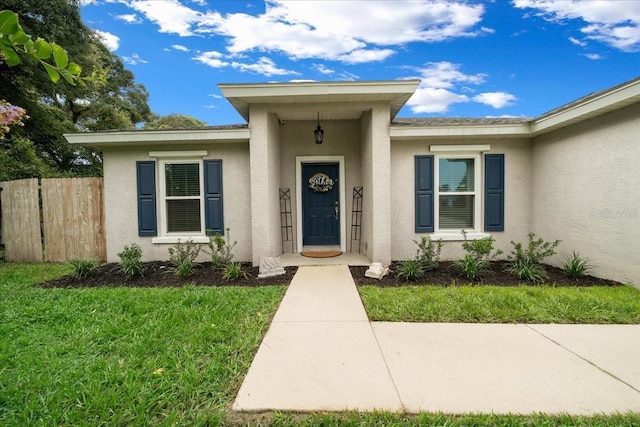 3946 SW 133rd Loop, Ocala, FL 34473 - property entrance featuring stucco siding
