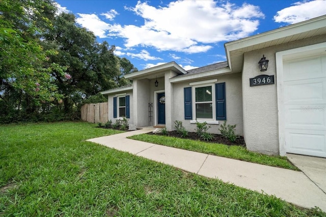 3946 SW 133rd Loop, Ocala, FL 34473 - entrance to property with stucco siding and a garage