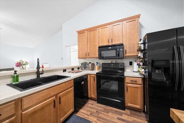 3946 SW 133rd Loop, Ocala, FL 34473 - kitchen featuring black appliances, wood finished floors, light countertops, and vaulted ceiling