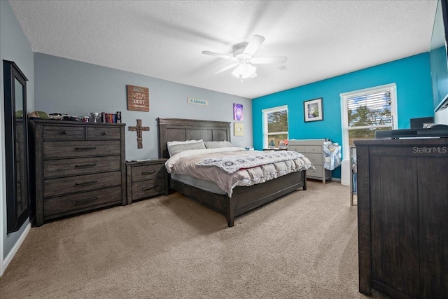 3946 SW 133rd Loop, Ocala, FL 34473 - bedroom featuring light colored carpet, a textured ceiling, and a ceiling fan